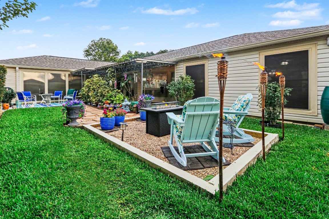 8327 Spring Wind Drive Houston, TX 77040 - Photo 23 of 30 Several patio spaces make it great for hosting and entertaining