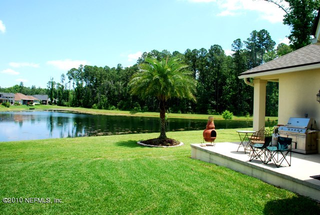 2571 Woodgrove Road Fleming Island, FL 32003 - Photo 6 of 36 Open Grilling Porch off Greatroom