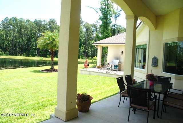 2571 Woodgrove Road Fleming Island, FL 32003 - Photo 7 of 36 Wrap around Porch off the Formal Living