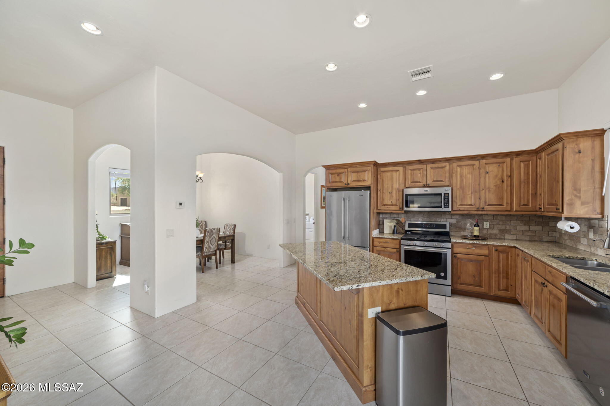 45 High View Court Tubac, AZ 85646 - Photo 18 of 44 a kitchen with stainless steel appliances kitchen island granite countertop a stove and a sink