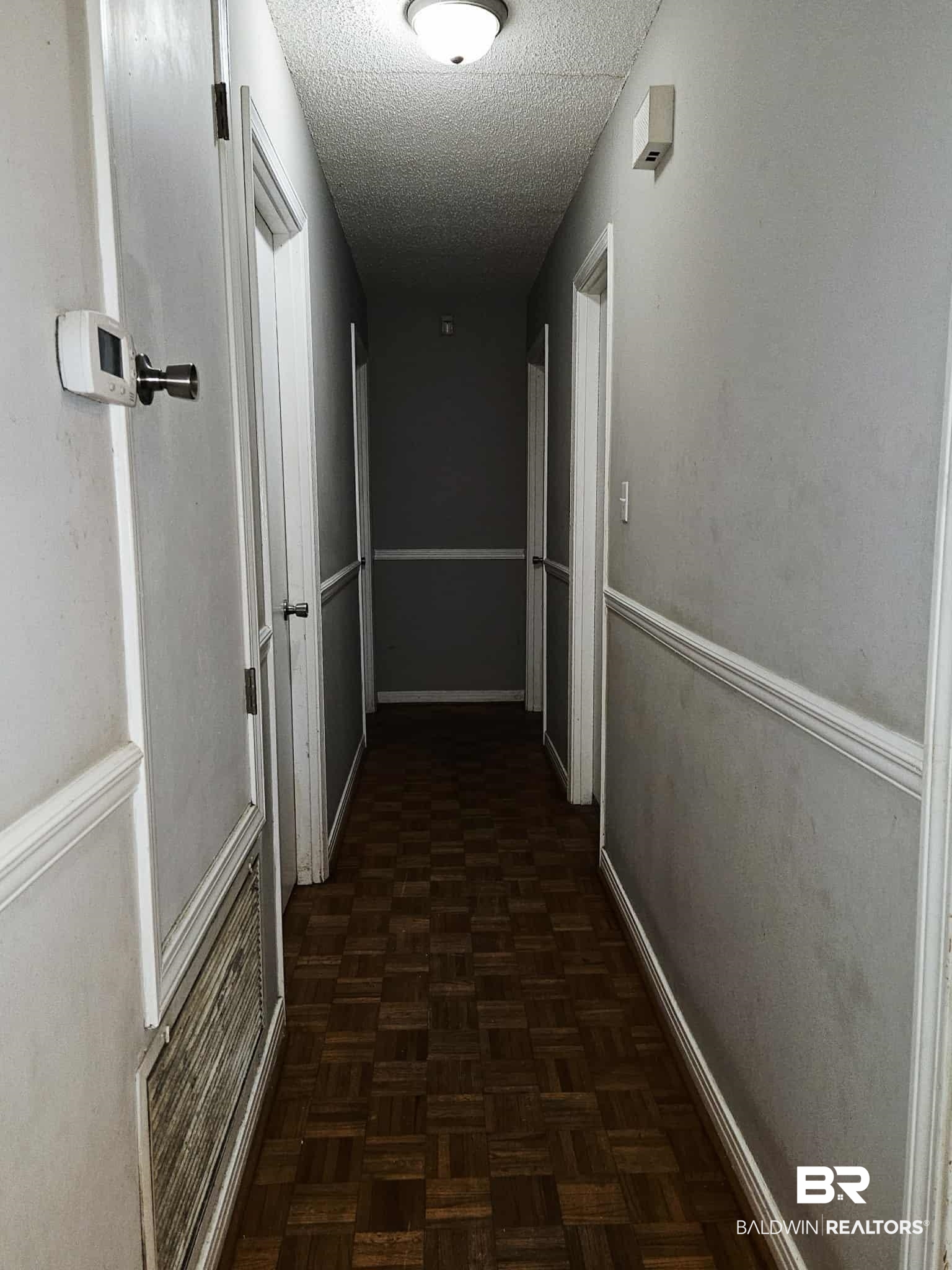 324 Vanderbilt Drive Mobile, AL 36608 - Photo 12 of 17 Corridor featuring a textured ceiling and baseboards