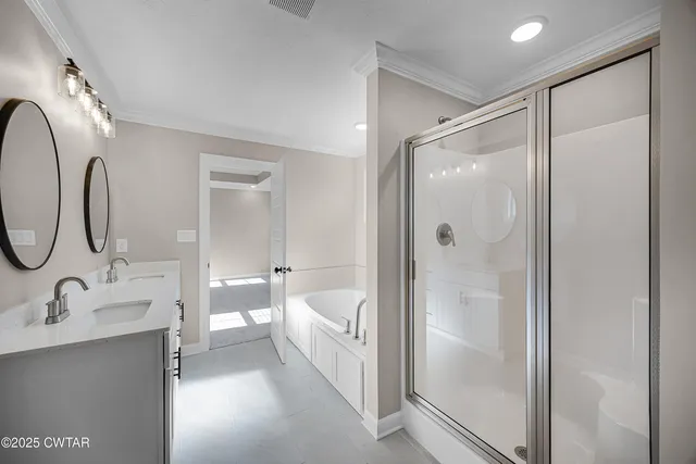 a bathroom with a double vanity sink mirror double and shower