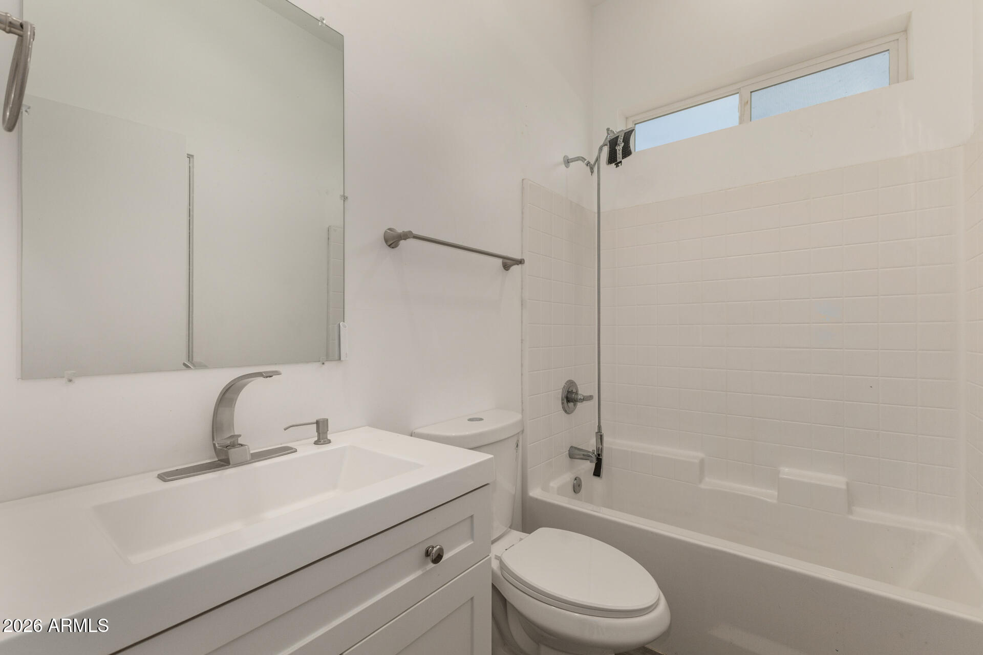 1933 East Monroe Street Phoenix, AZ 85034 - Photo 11 of 18 a bathroom with a sink toilet and shower