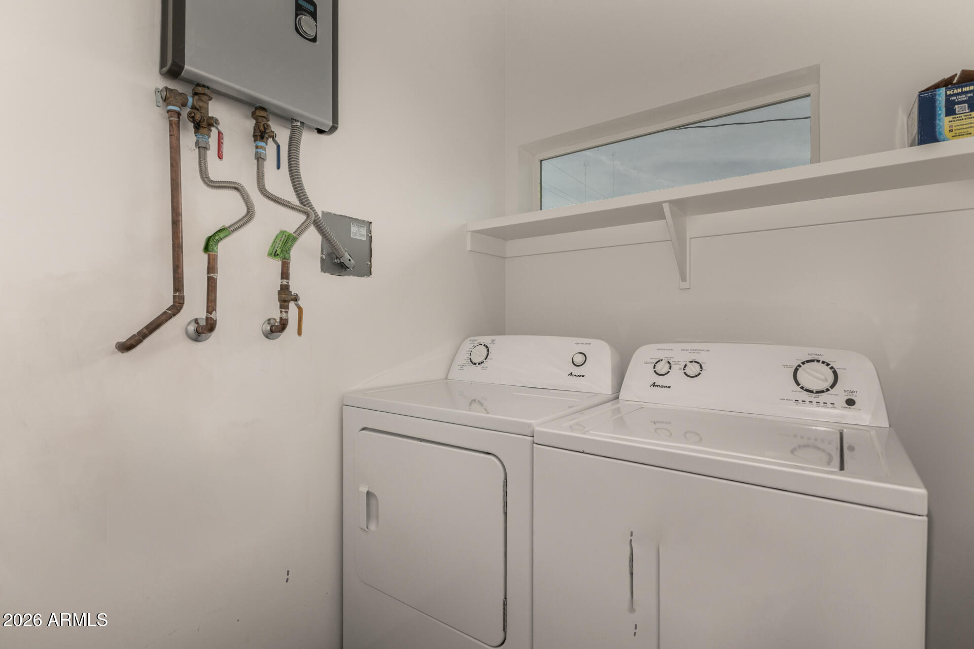 1933 East Monroe Street Phoenix, AZ 85034 - Photo 12 of 18 a view of storage and utility room with washer and dryer