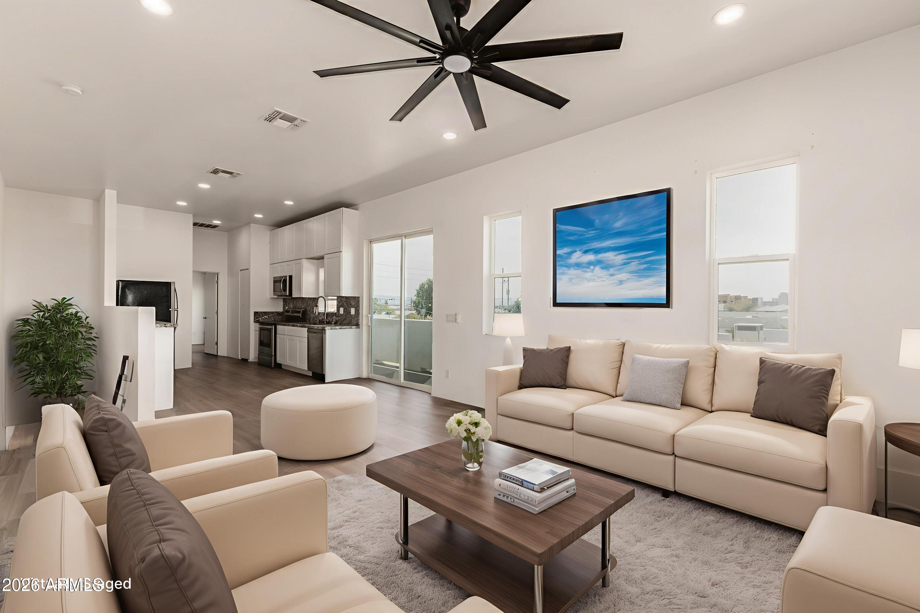 1933 East Monroe Street Phoenix, AZ 85034 - Photo 4 of 18 a living room with furniture kitchen view and a chandelier