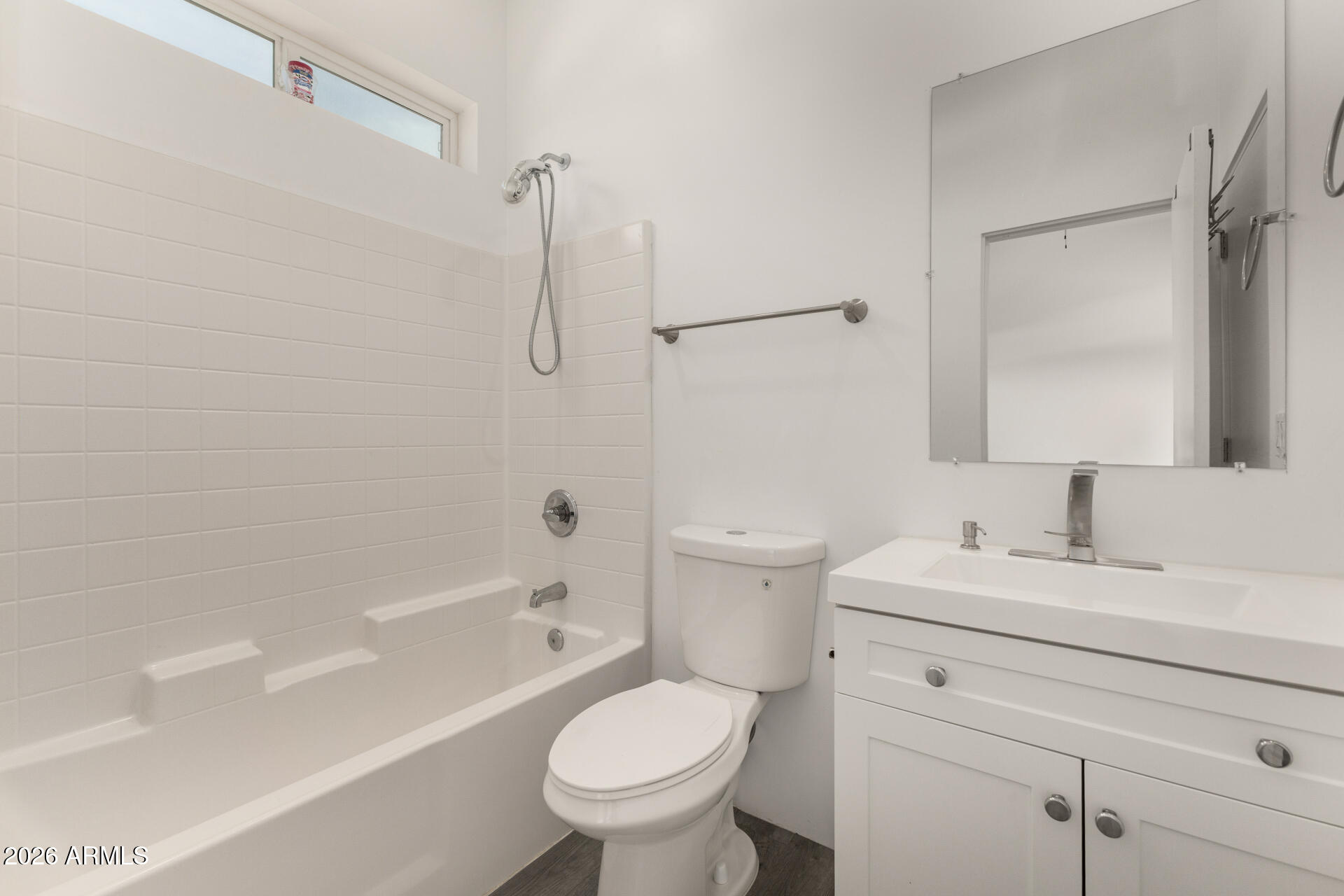 1933 East Monroe Street Phoenix, AZ 85034 - Photo 9 of 18 a bathroom with a sink toilet vanity and shower