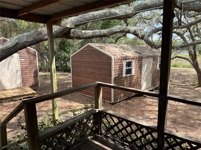a view of a balcony with a tree