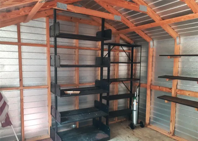 a view of a room with racks on the wall