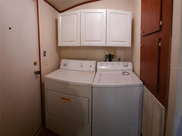a utility room with dryer and washer
