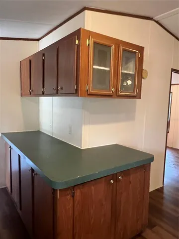 a kitchen with a sink and cabinets