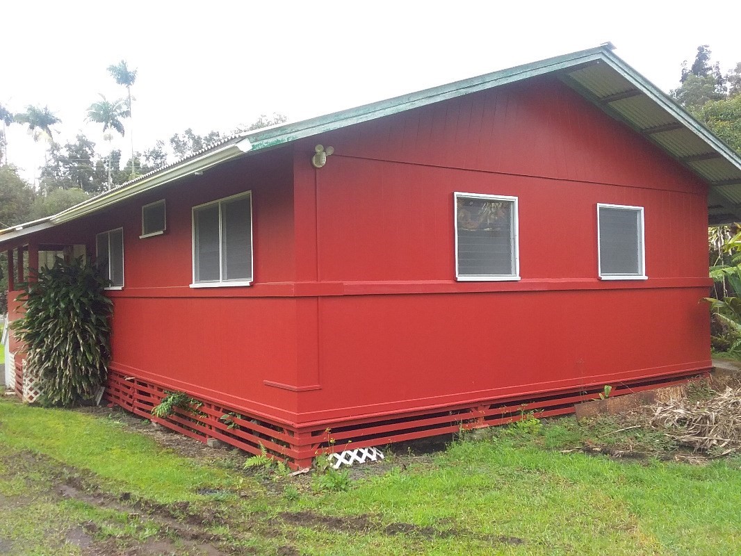 18-1656 Volcano Road Mountain View, HI 96771 - Photo 3 of 14 a front view of a house with garden