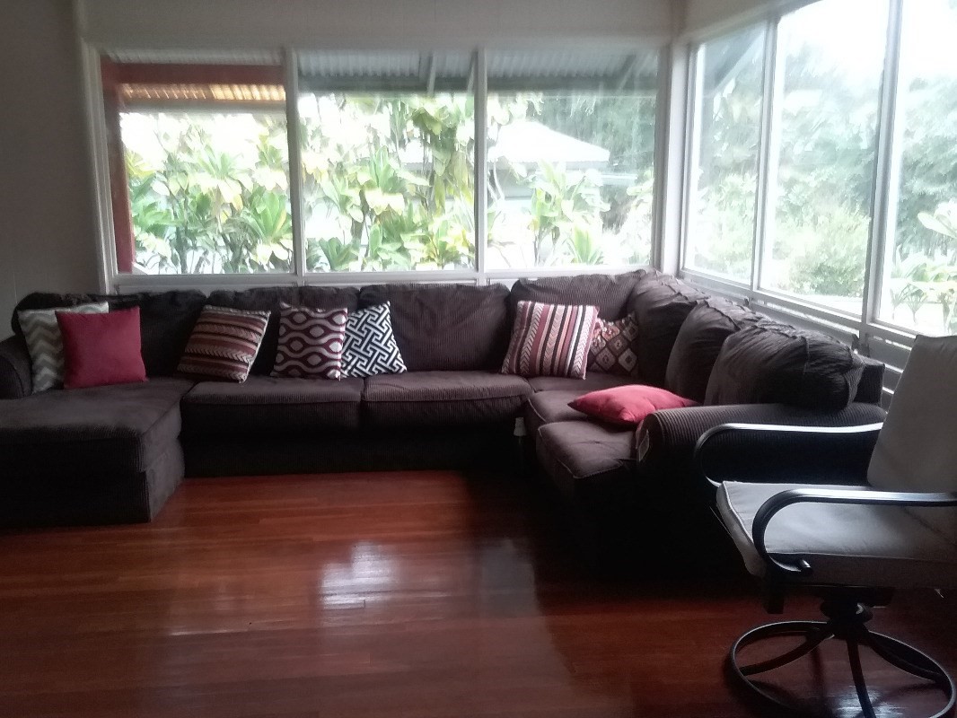 18-1656 Volcano Road Mountain View, HI 96771 - Photo 7 of 14 a living room with furniture and a large window