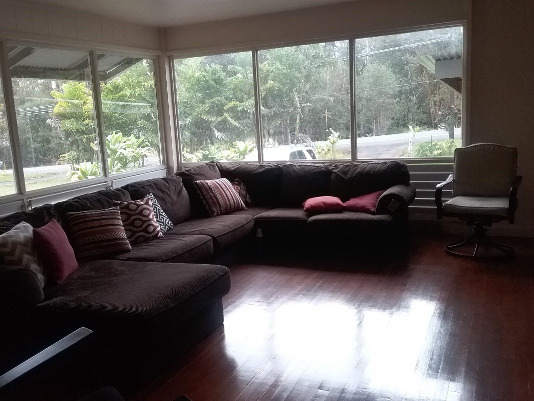 18-1656 Volcano Road Mountain View, HI 96771 - Photo 8 of 14 a living room with furniture and a large window