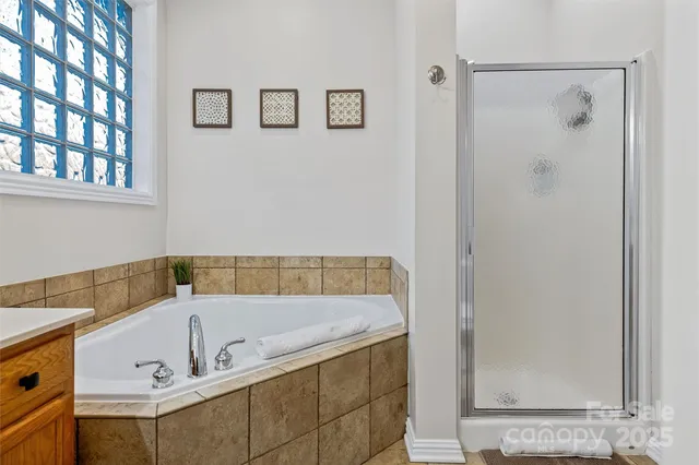 a view of balcony with wooden floor and outdoor seating