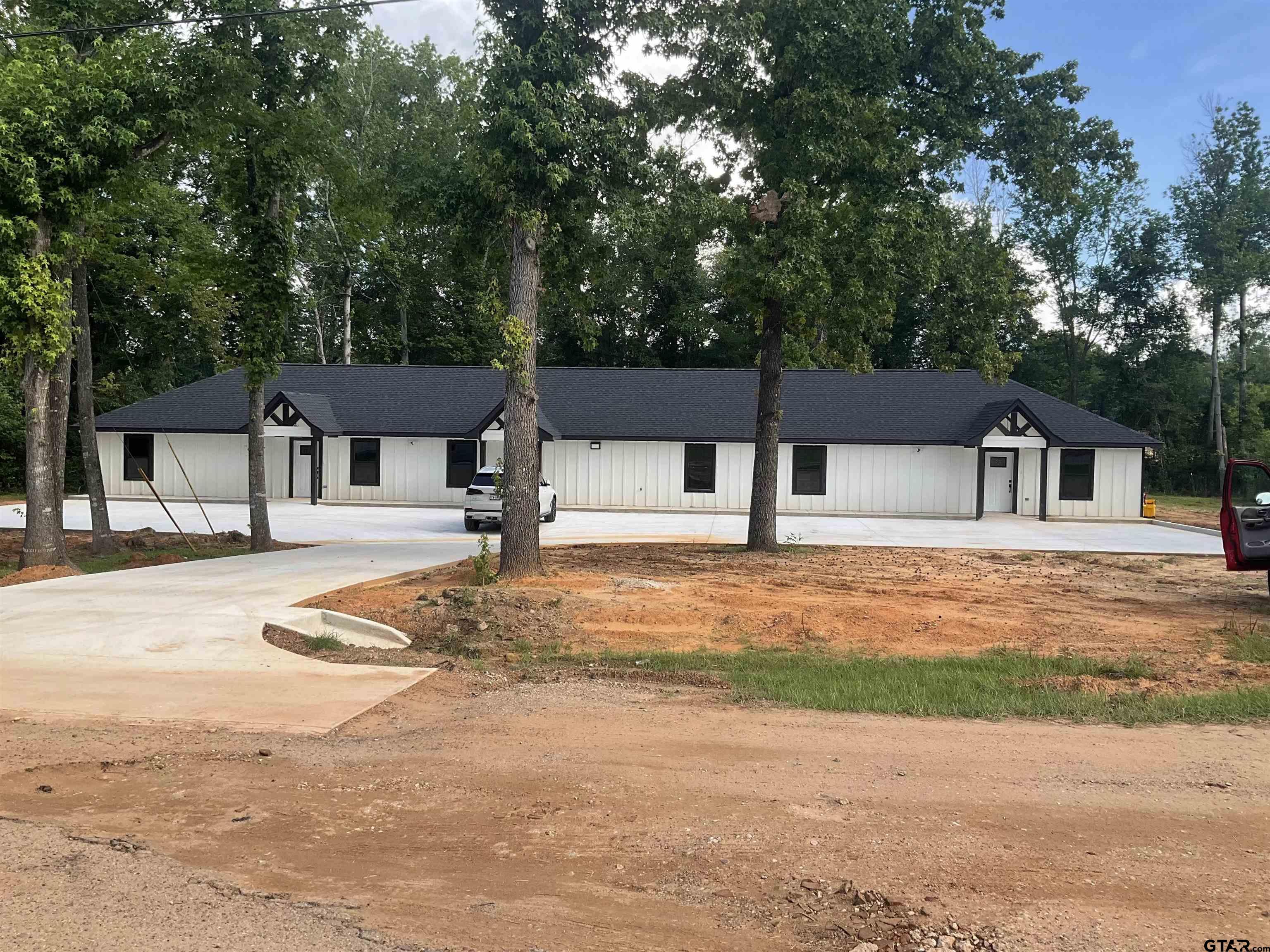 a house with trees in front of it