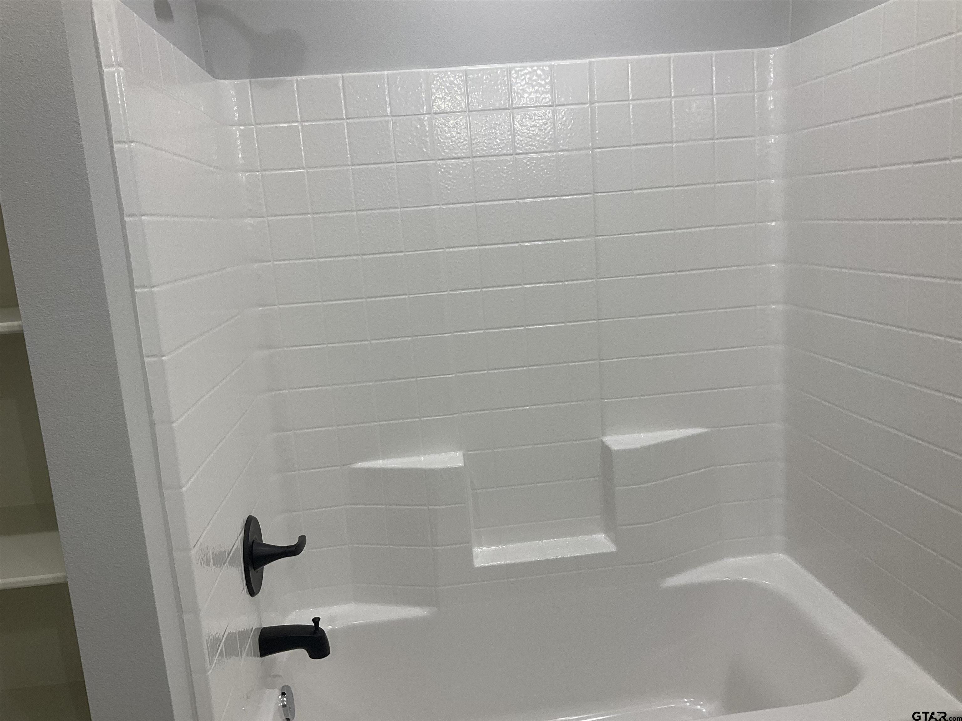 13220 Teton Road Tyler, TX 75709 - Photo 15 of 35 a close up of a bathtub