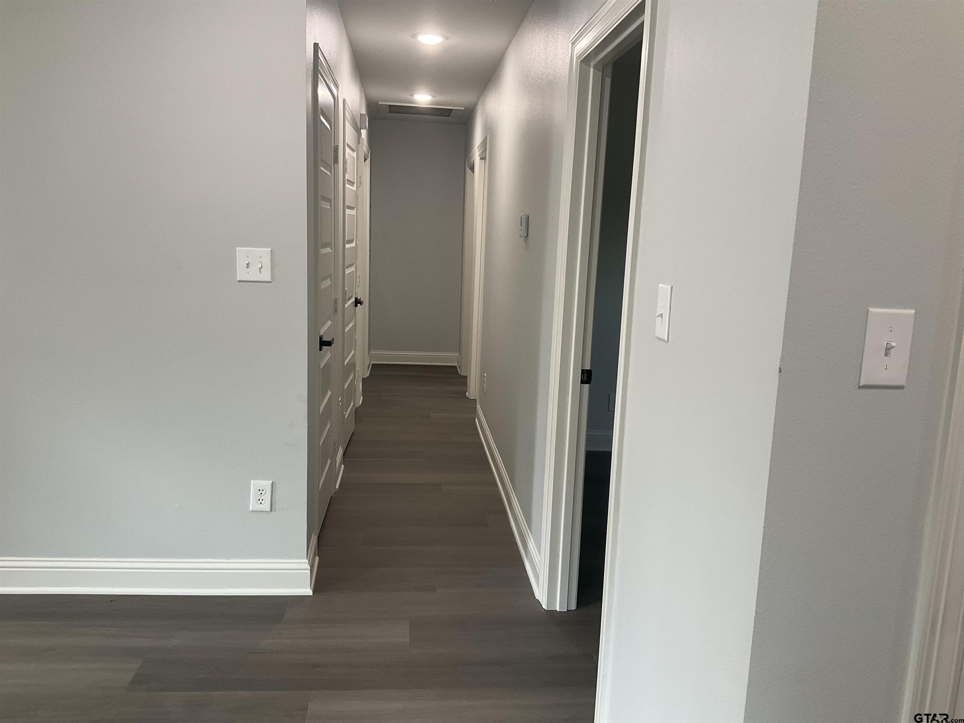 13220 Teton Road Tyler, TX 75709 - Photo 21 of 35 a view of a hallway with wooden floor
