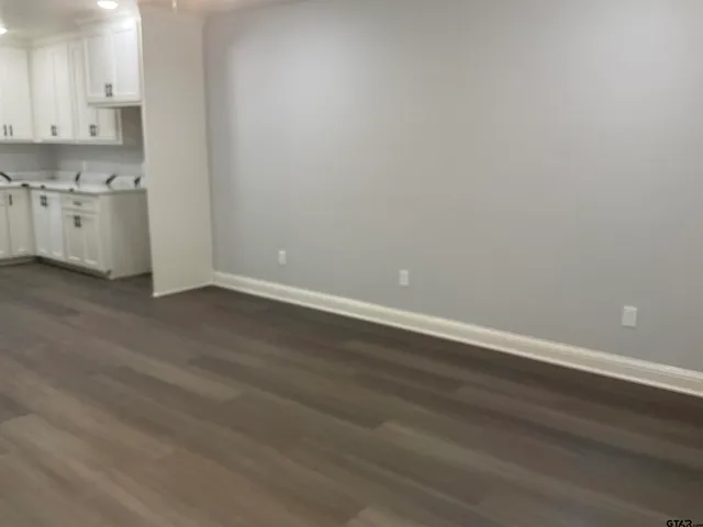 a view of kitchen with wooden floor