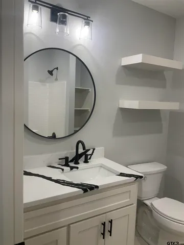a bathroom with a sink and mirror