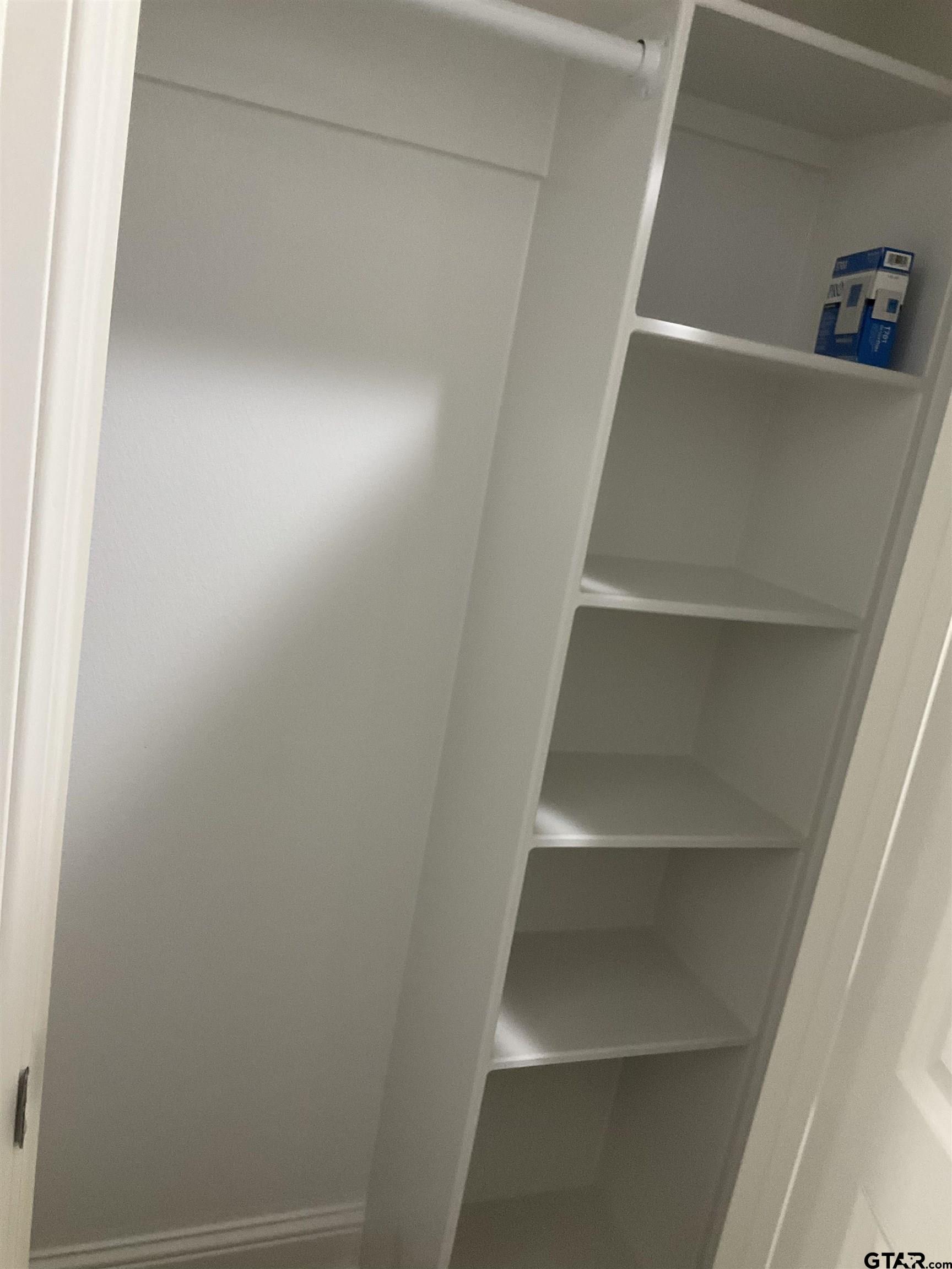 13220 Teton Road Tyler, TX 75709 - Photo 7 of 35 a view of walk in closet with empty racks