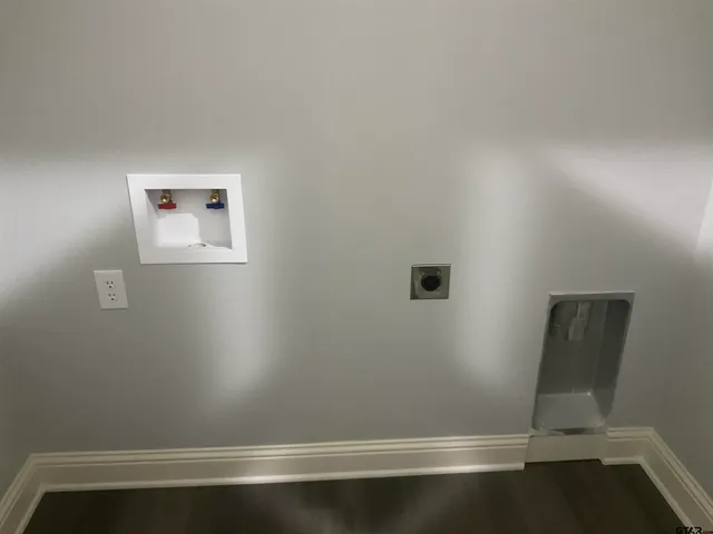 a view of room with racks on the wall