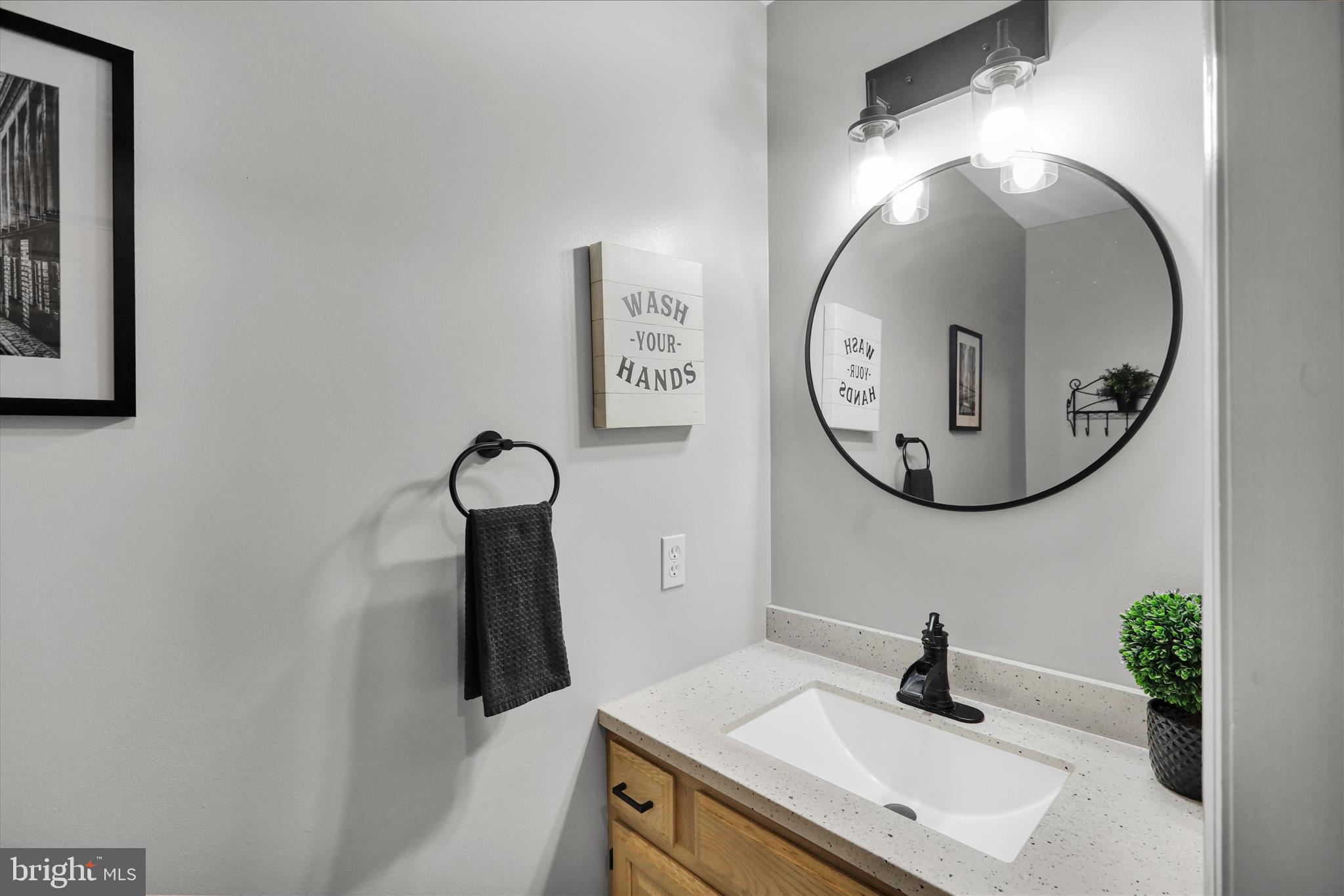 2930 Reedy Road Sinking Spring, PA 19608 - Photo 15 of 45 a bathroom with a sink and a mirror