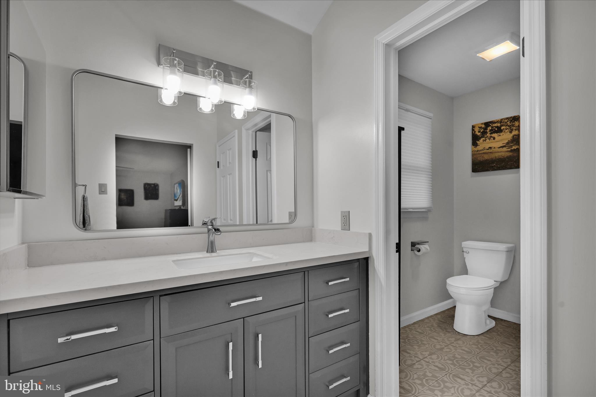 2930 Reedy Road Sinking Spring, PA 19608 - Photo 20 of 45 a bathroom with a toilet sink and mirror