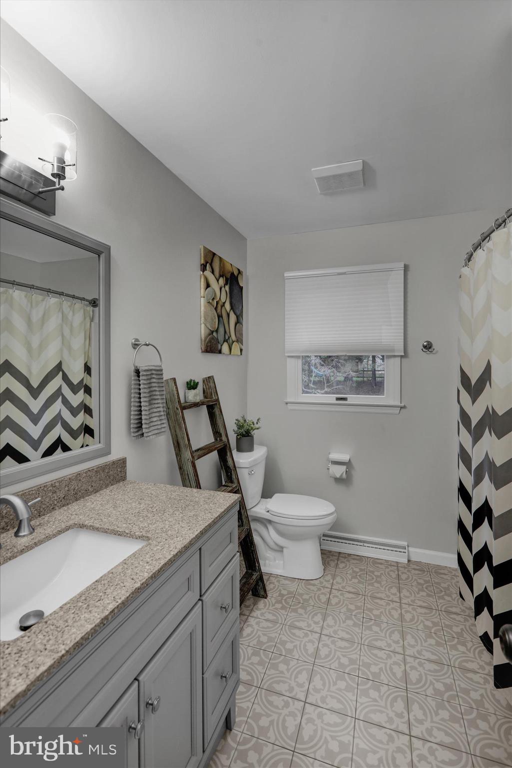 2930 Reedy Road Sinking Spring, PA 19608 - Photo 26 of 45 a bathroom with a granite countertop sink a toilet and a mirror