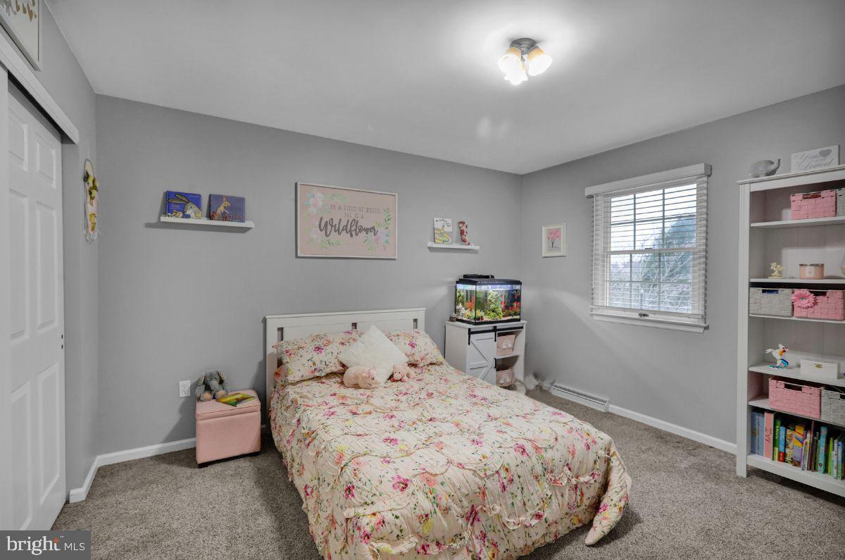 2930 Reedy Road Sinking Spring, PA 19608 - Photo 27 of 45 a bedroom with a bed and a book shelf