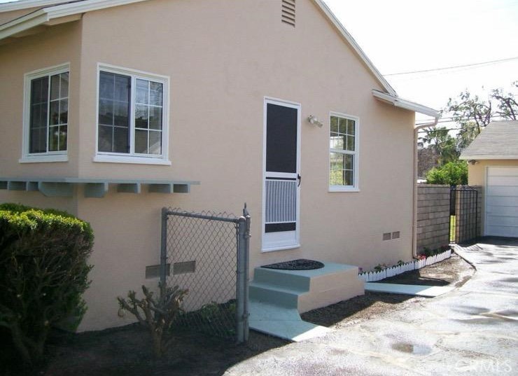 1776 Fleming Street Pomona, CA 91766 - Photo 22 of 24 Side yard and side yard door
