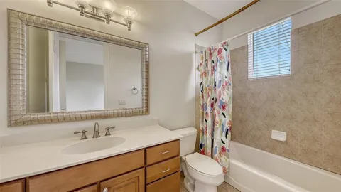 an aerial view of a house with a lake view