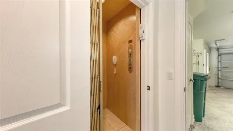 a dining room with furniture a rug and a chandelier