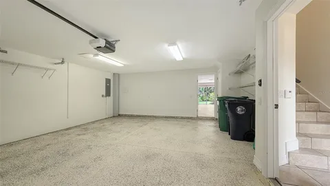 an aerial view of a house with a garden and swimming pool