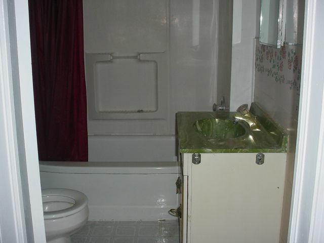 Nna Pongala Road Tieton, WA 98947 - Photo 3 of 9 a bathroom with a granite countertop sink and toilet