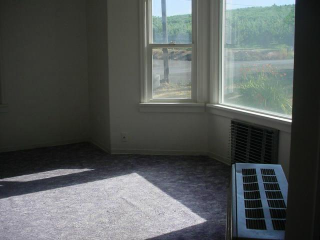 Nna Pongala Road Tieton, WA 98947 - Photo 5 of 9 a view of wooden floor and windows in an empty room