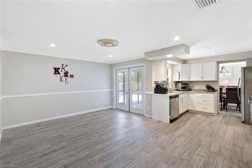 8110 Valencia Road Fort Myers, FL 33967 - Photo 9 of 27 Family room/den located off the kitchen with French doors to lanai.