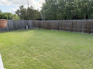 6720 Cromarty Lane Austin, TX 78754 - Photo 7 of 24 An ample green space enclosed by a sturdy privacy fence offers an ideal setting for outdoor activities.
