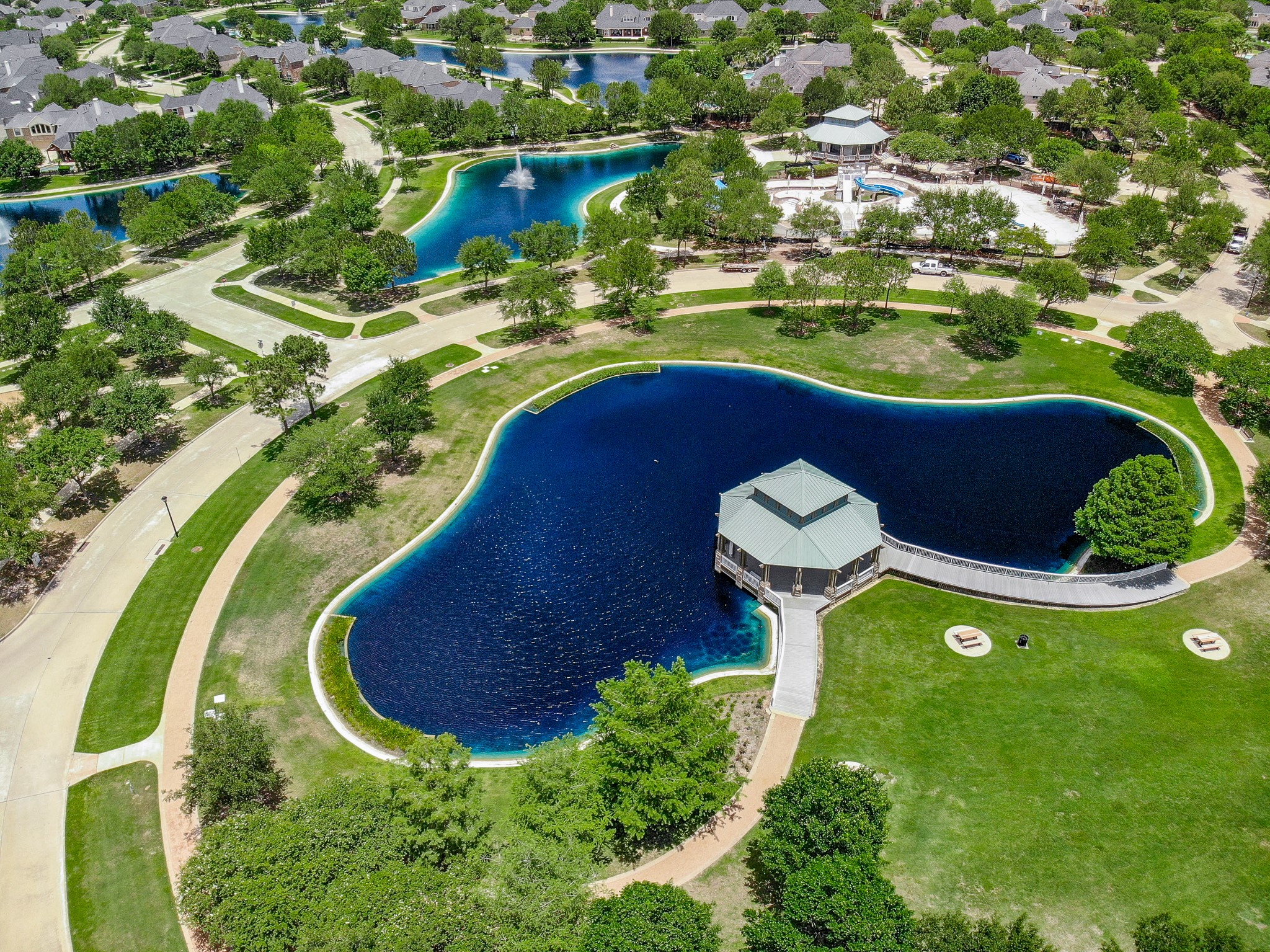 7218 Spring Run Lane Katy, TX 77494 - Photo 39 of 49 a view of a swimming pool with a yard and plants