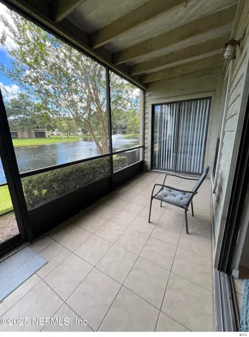 a view of two chairs in the balcony
