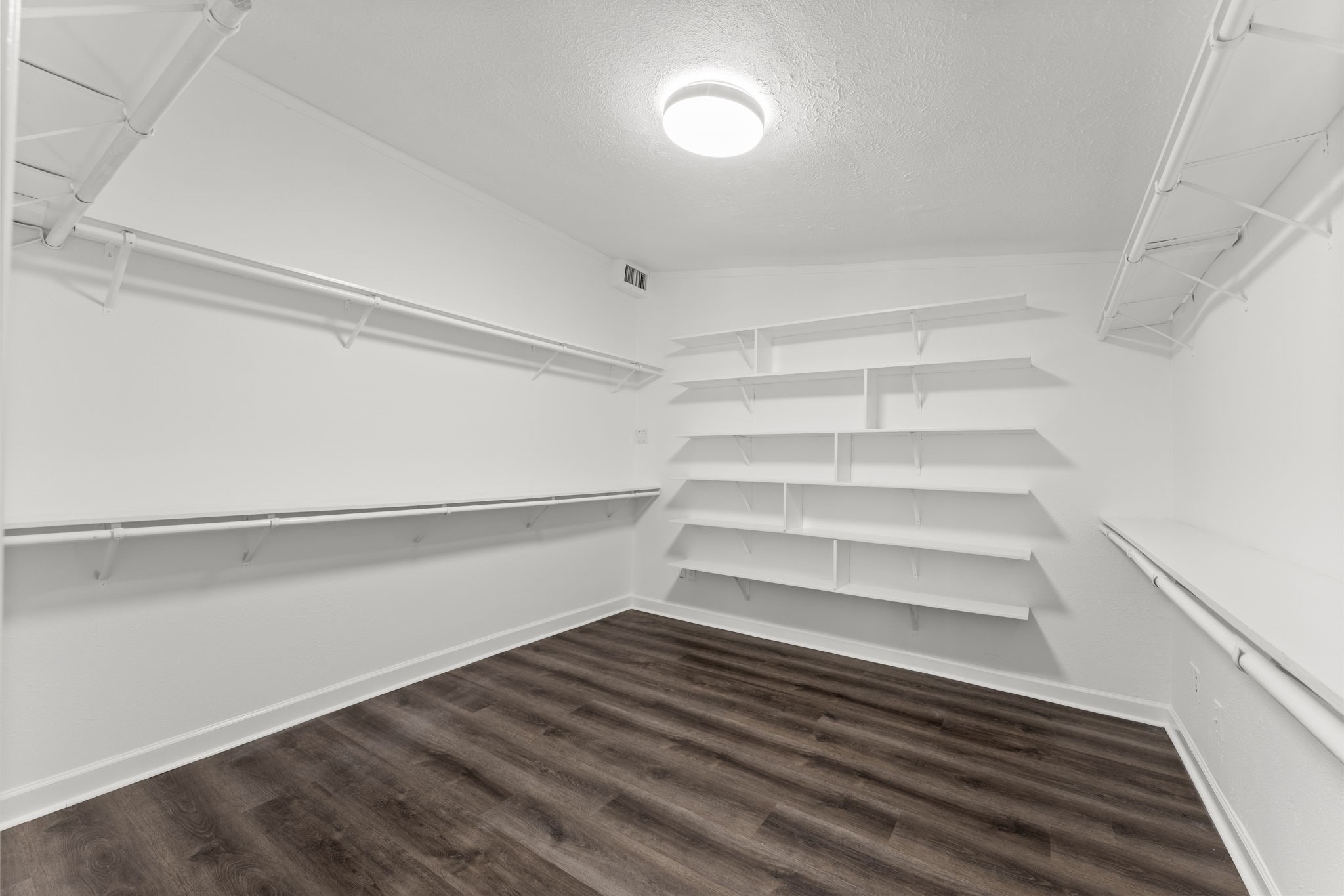 1678 Beaconshire Houston, TX 77077 - Photo 14 of 30 a view of walk in closet with empty racks