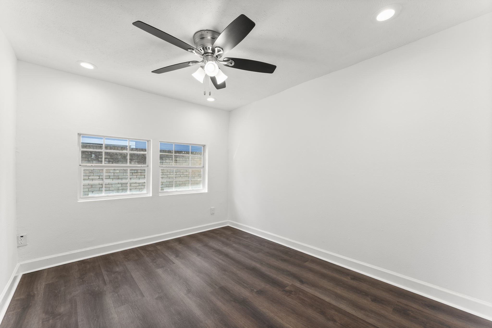1678 Beaconshire Houston, TX 77077 - Photo 15 of 30 an empty room with a window and a fan