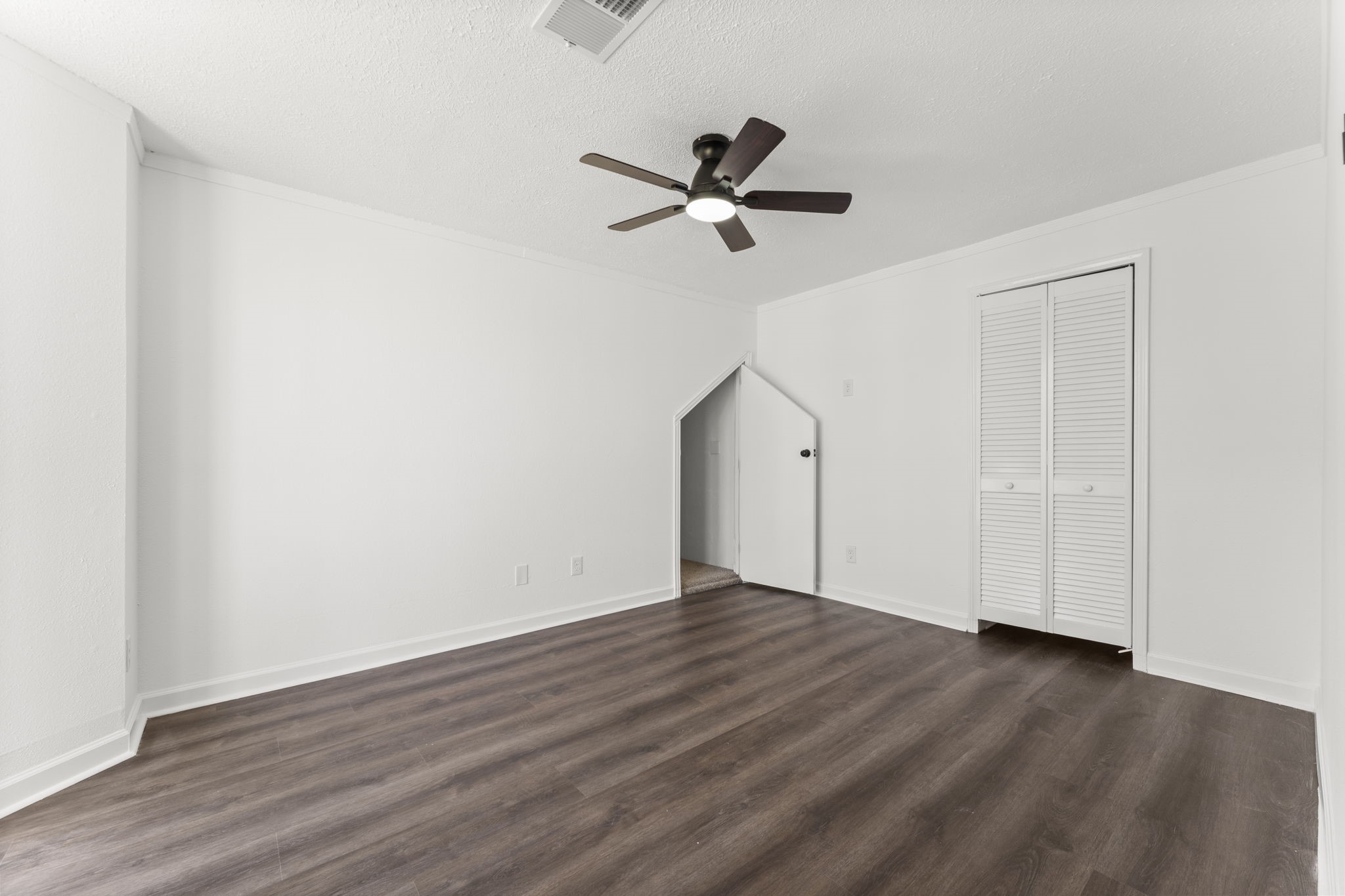 1678 Beaconshire Houston, TX 77077 - Photo 17 of 30 a view of an empty room with wooden floor