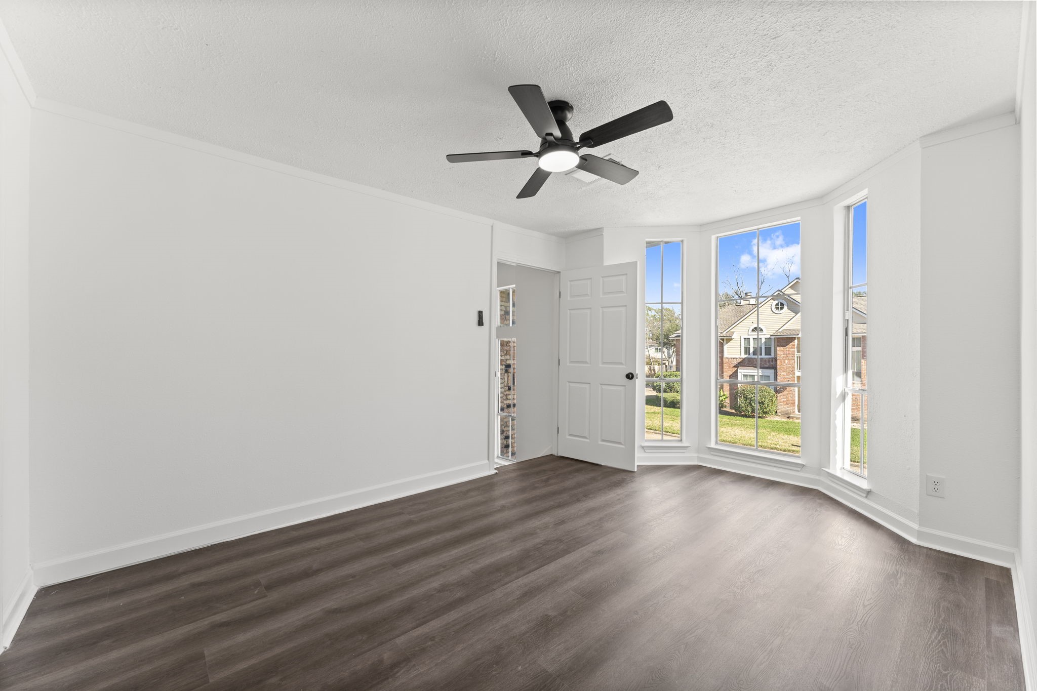 1678 Beaconshire Houston, TX 77077 - Photo 20 of 30 wooden floor in an empty room with a window