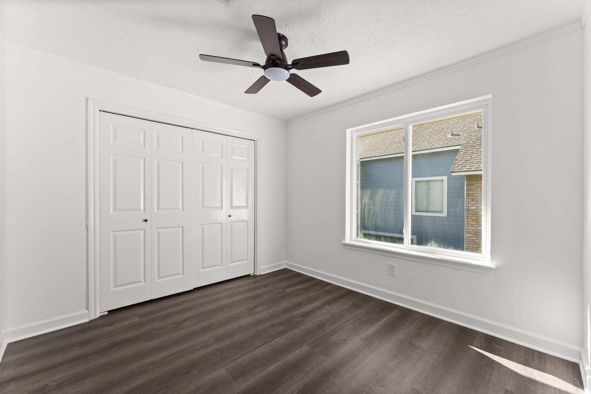1678 Beaconshire Houston, TX 77077 - Photo 21 of 30 a view of a livingroom with a hardwood floor and a ceiling fan