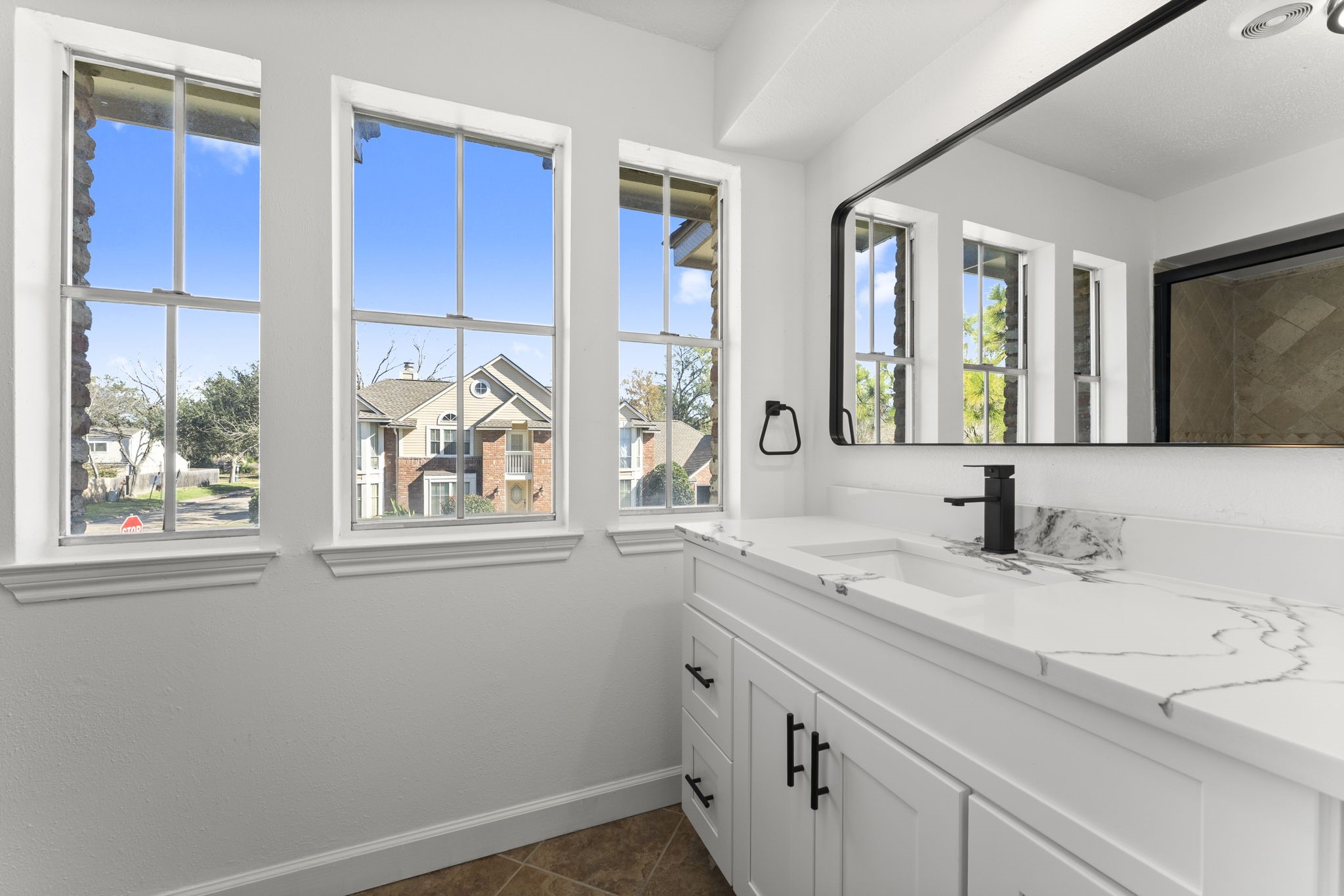 1678 Beaconshire Houston, TX 77077 - Photo 22 of 30 a bathroom with a sink and a window