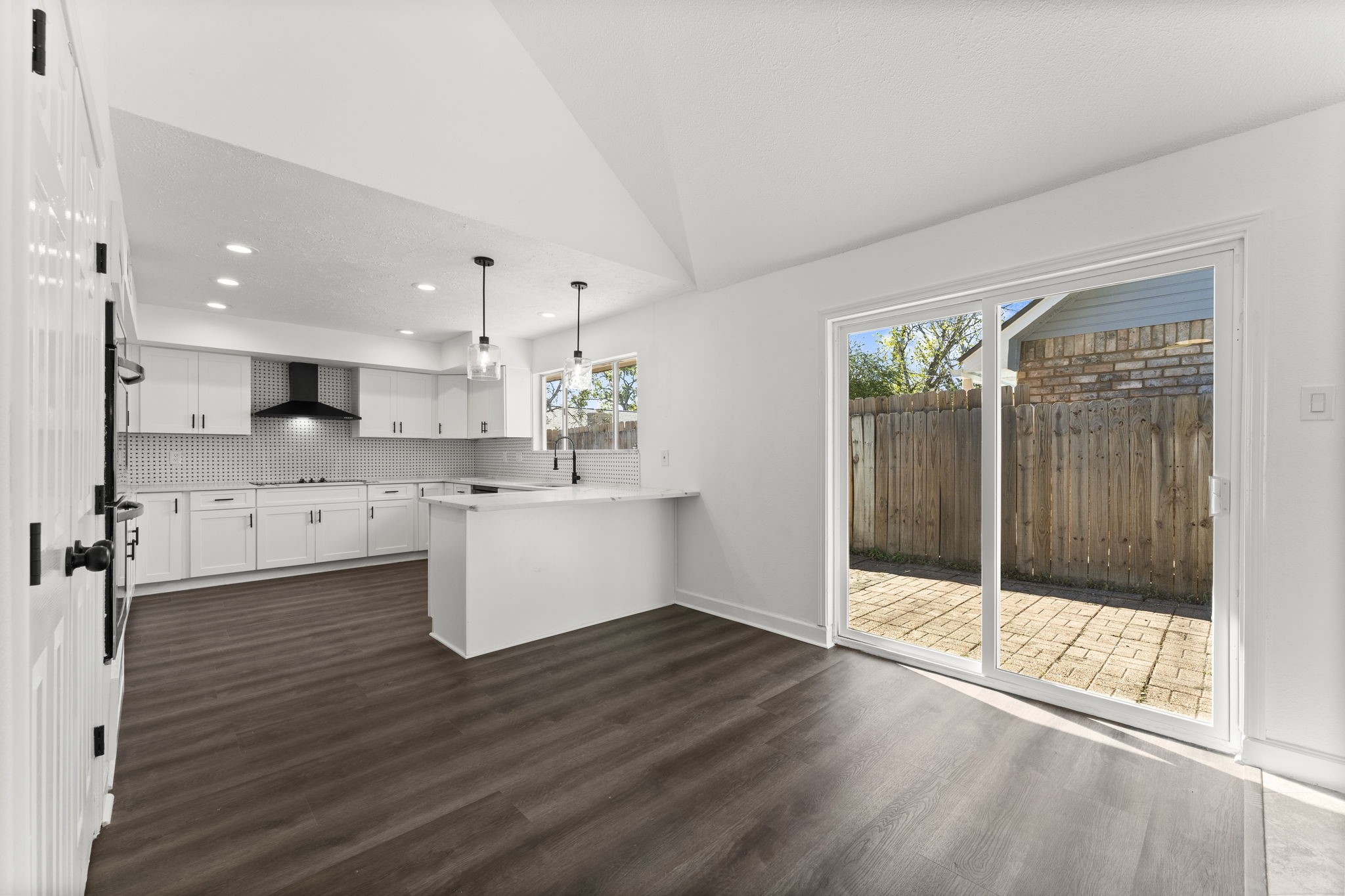 1678 Beaconshire Houston, TX 77077 - Photo 7 of 30 a view of a kitchen with wooden floor and electronic appliances