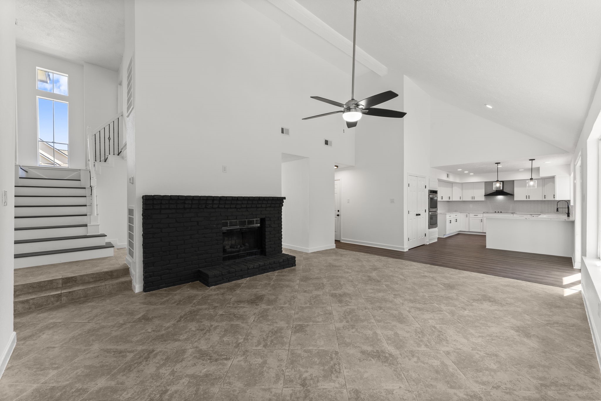 1678 Beaconshire Houston, TX 77077 - Photo 9 of 30 a view of kitchen and hallway with a fireplace