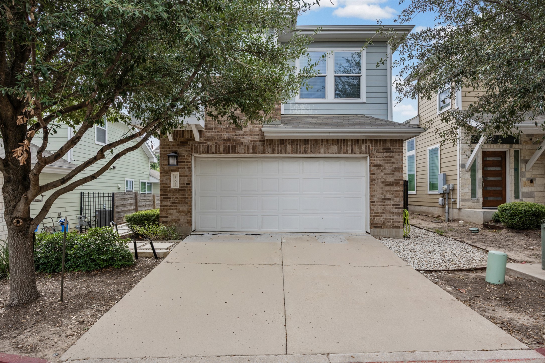 2303 Capulet Street Austin, TX 78741 - Photo 2 of 24 This inviting two-story home features a double-wide driveway with plenty of parking space. The attached two-car garage offers convenient parking and additional storage.