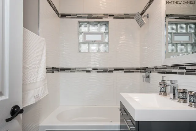 a bathroom with a sink and a bathtub