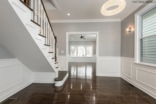 a view of an entryway with wooden floor